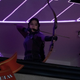 Kate aiming an arrow down.